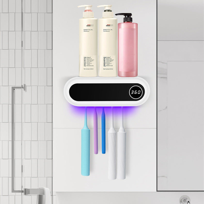 Wall-mounted toothbrush holder with a smart UV sterilizer, toothpaste dispenser, and squeezer, perfect for bathroom accessories.