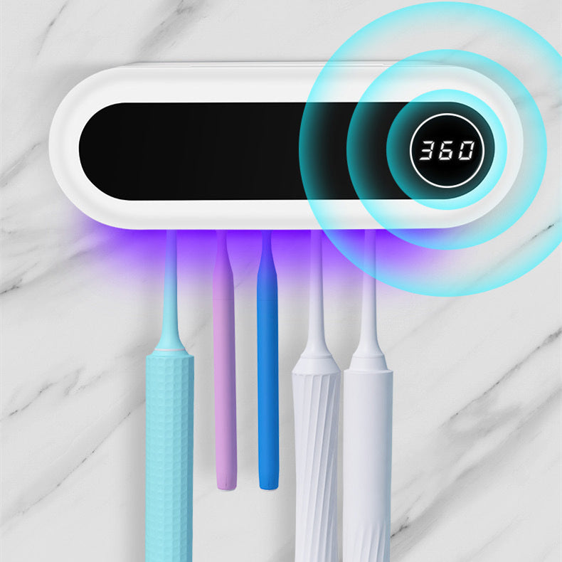 Wall-mounted toothbrush holder with a smart UV sterilizer, toothpaste dispenser, and squeezer, perfect for bathroom accessories.