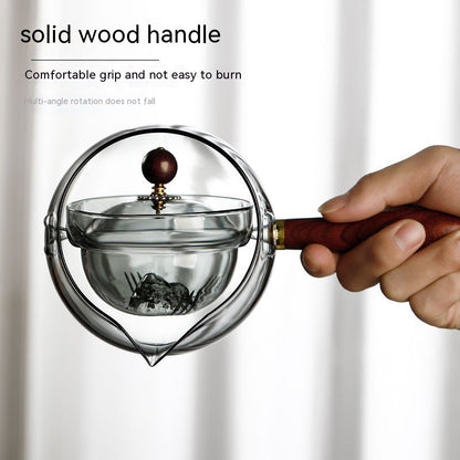 Semi-automatic rotary heat-resistant glass teapot with an infuser and wooden handle, perfect for effortless tea making. A stylish accessory for both office and home, blending functionality and elegance in your kitchen gadgets.