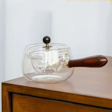 Semi-automatic rotary heat-resistant glass teapot with an infuser and wooden handle, perfect for effortless tea making. A stylish accessory for both office and home, blending functionality and elegance in your kitchen gadgets.