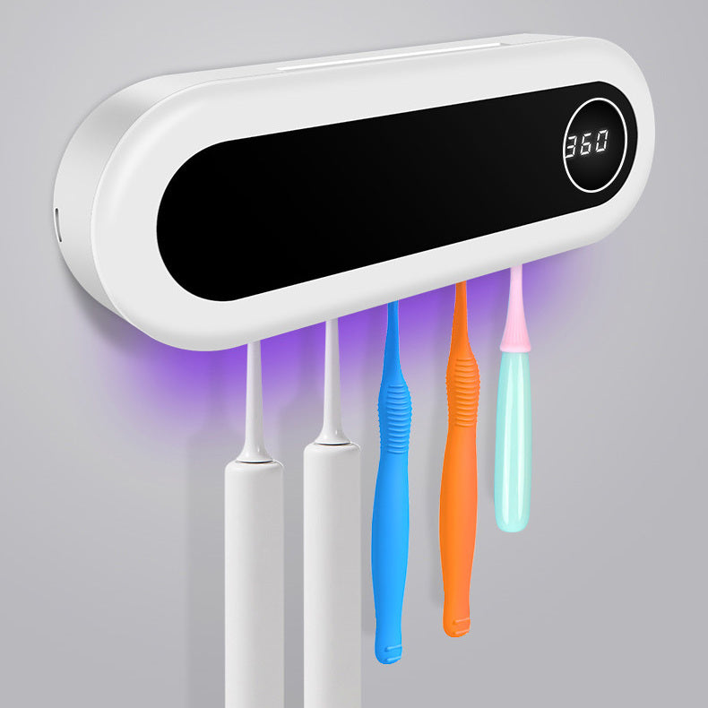 Wall-mounted toothbrush holder with a smart UV sterilizer, toothpaste dispenser, and squeezer, perfect for bathroom accessories.
