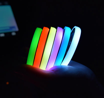 Colorful LED car cup holder coaster with USB charging, non-slip design, and automatic ambient lighting for cars.