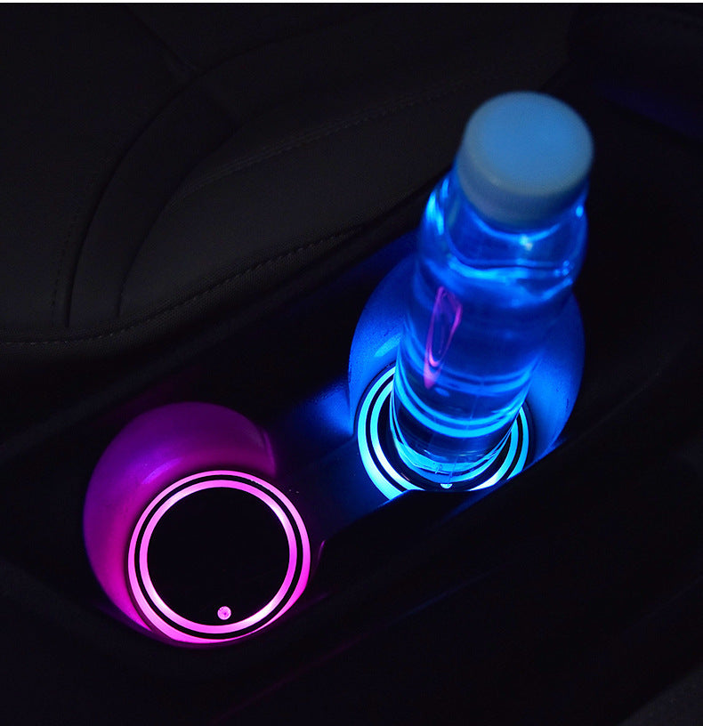 Colorful LED car cup holder coaster with USB charging, non-slip design, and automatic ambient lighting for cars.