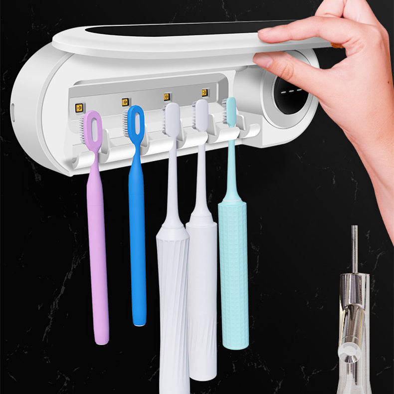 Wall-mounted toothbrush holder with a smart UV sterilizer, toothpaste dispenser, and squeezer, perfect for bathroom accessories.
