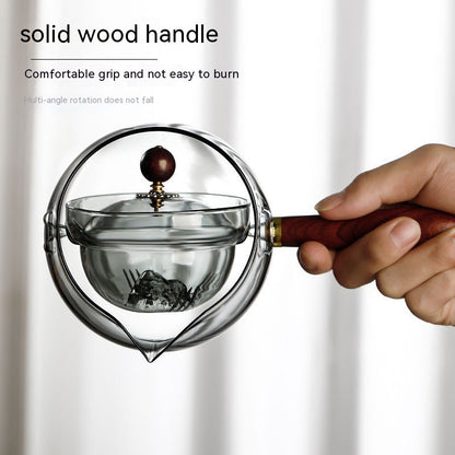 Semi-automatic rotary heat-resistant glass teapot with an infuser and wooden handle, perfect for effortless tea making. A stylish accessory for both office and home, blending functionality and elegance in your kitchen gadgets.